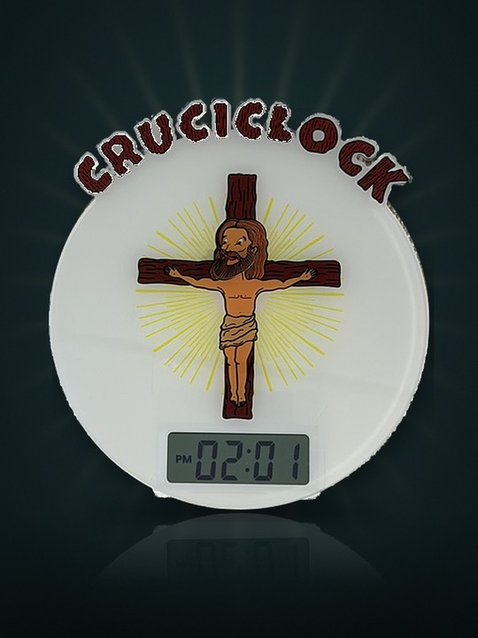 Photo of the real Cruciclock: CRUCICLOCK lettering above the cross, with the digital display below